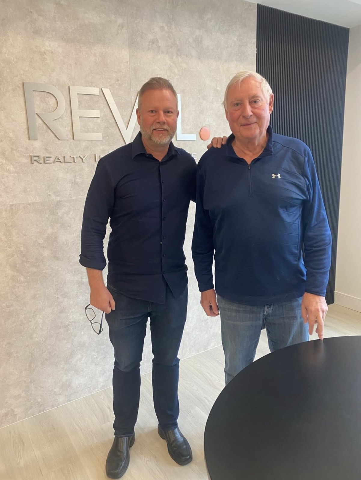Doug Gordon with his father, Ron Gordon, at Revel Realty Durham. Ron spent 35 years as a real estate broker and brokerage owner.