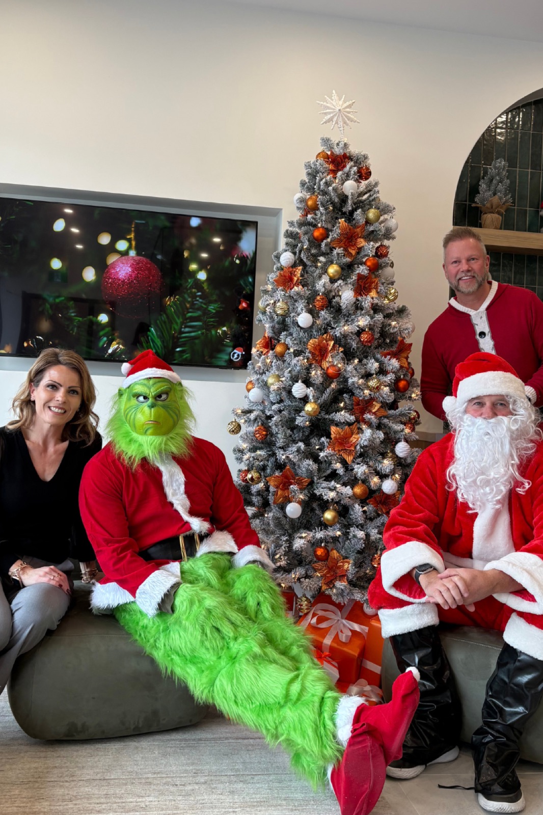 The Gordon Brothers Team at a holiday community celebration with Santa and the Grinch