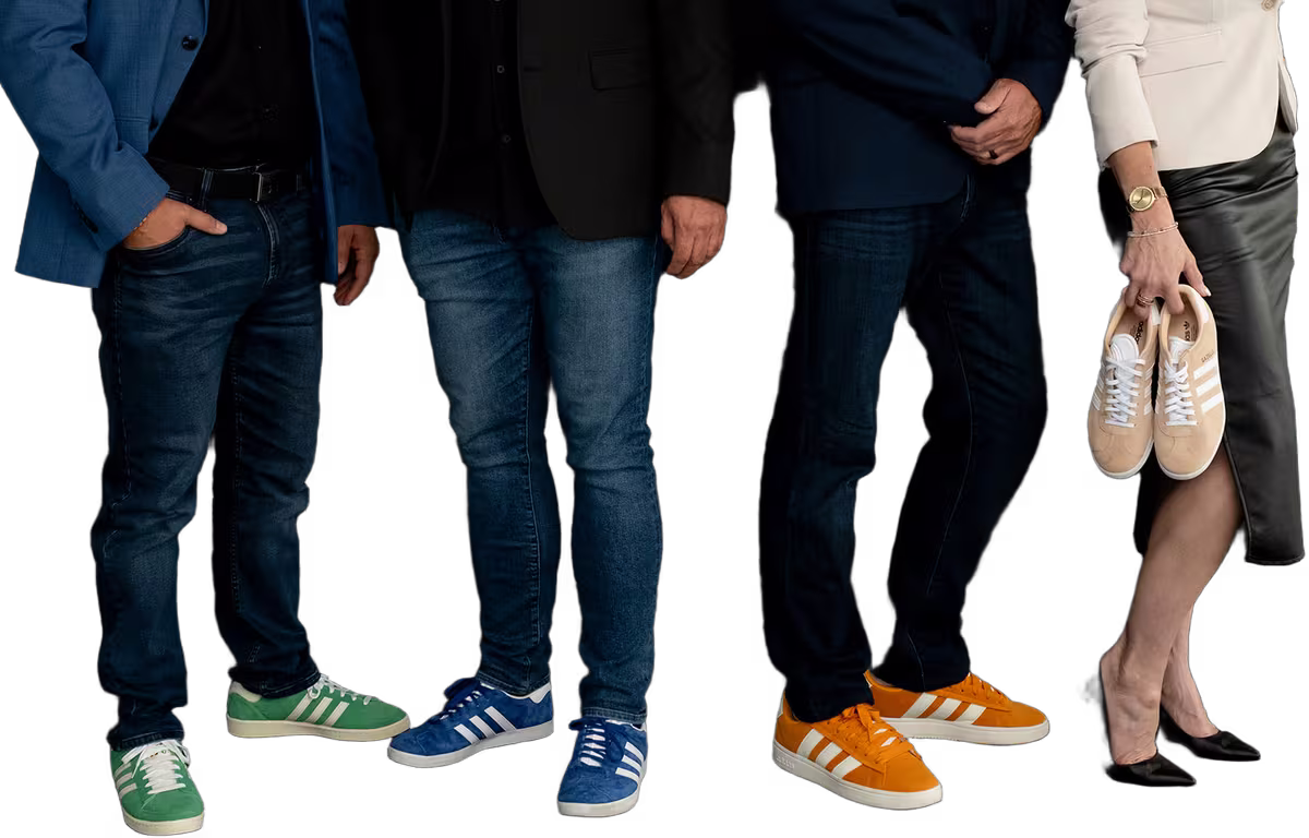The Gordon Brothers Team standing side by side in their colourful sneakers