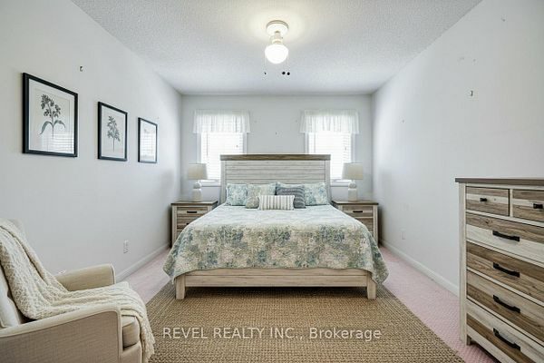 Third-floor second bedroom with a double closet at 1400 The Esplanade N #411, Pickering, listed by The Gordon Brothers Team, Revel Realty Inc., Brokerage