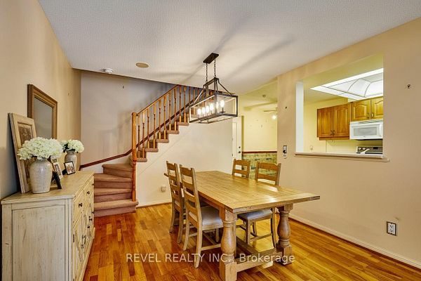 Combined dining area with hardwood flooring and open-concept layout at 1400 The Esplanade N #411, Pickering, listed by The Gordon Brothers Team, Revel Realty Inc., Brokerage