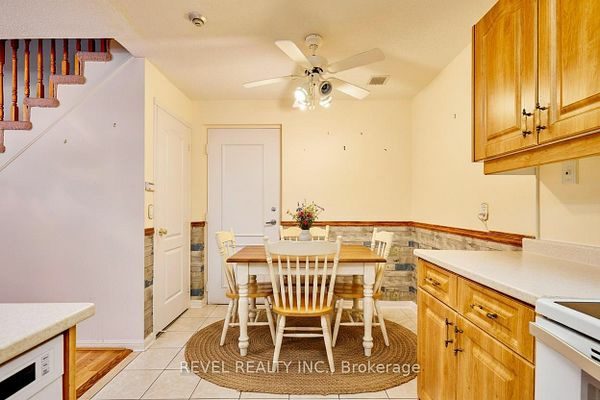 Eat-in galley kitchen with ceramic flooring at 1400 The Esplanade N #411, Pickering, listed by The Gordon Brothers Team, Revel Realty Inc., Brokerage