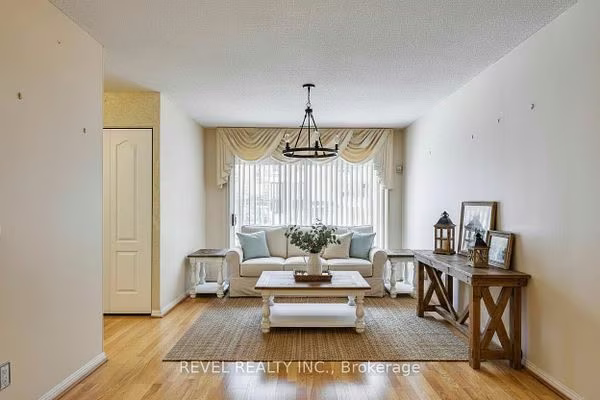 Open-concept living room with hardwood flooring at 1400 The Esplanade N #411, Pickering, listed by The Gordon Brothers Team, Revel Realty Inc., Brokerage