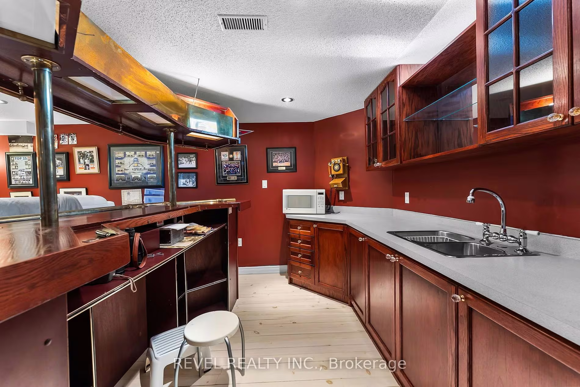 Basement bar with hockey memorabilia at 1486 Ashwood Gate, Pickering, listed by The Gordon Brothers Team, Revel Realty Inc., Brokerage