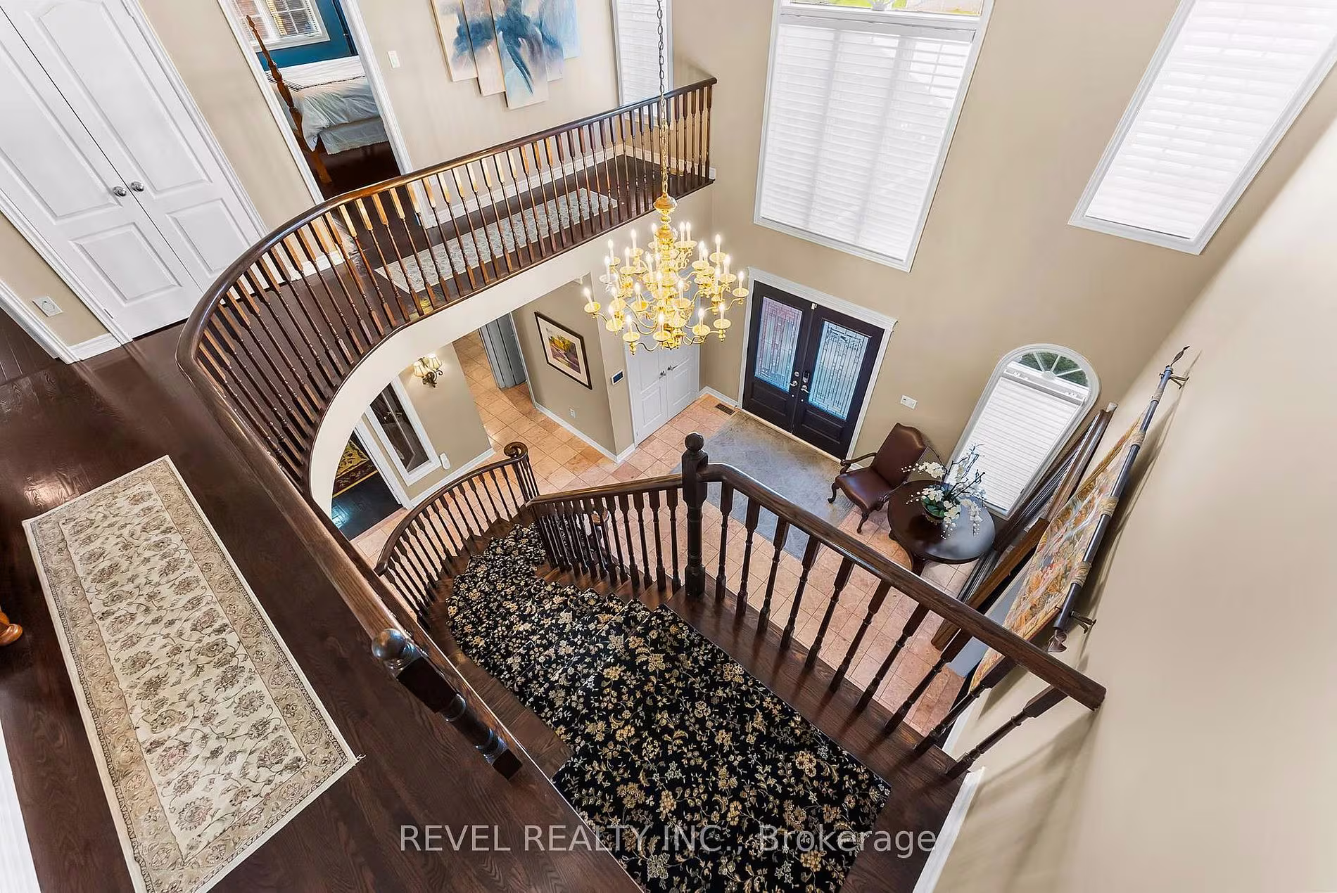 View down from the upper landing to the foyer below at 1486 Ashwood Gate, Pickering, listed by The Gordon Brothers Team, Revel Realty Inc., Brokerage