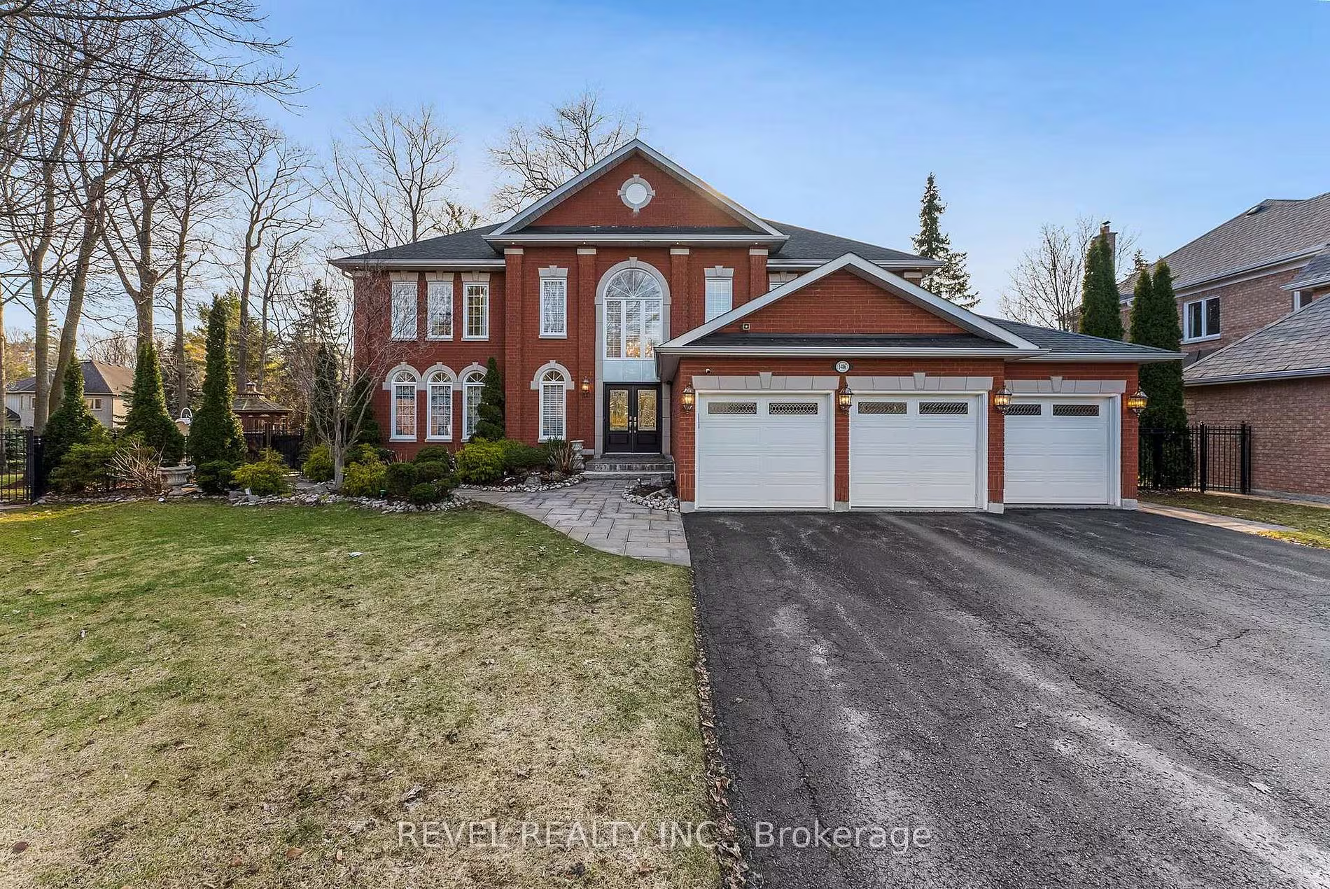 1486 Ashwood Gate, Pickering: a red-brick executive home with a three-car garage in the Tall Trees Enclave of Rougemount, listed by The Gordon Brothers Team, Revel Realty Inc., Brokerage