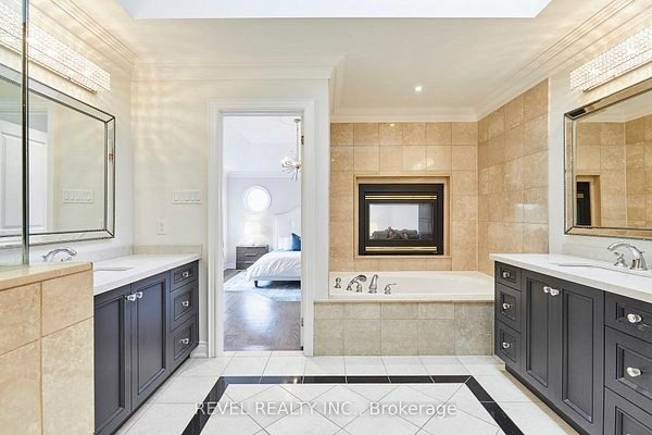 Spa-like primary ensuite with a soaker tub and fireplace at 475 Poplar Avenue, Ajax