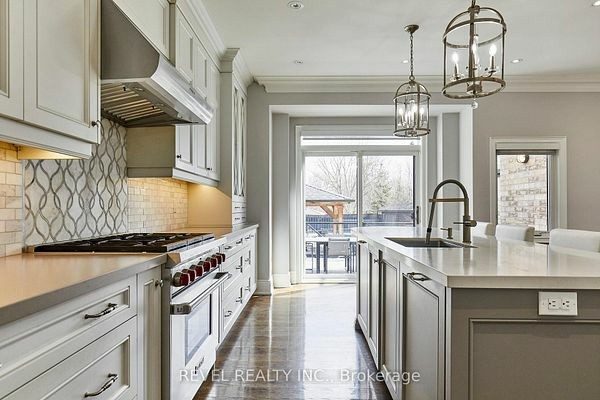Chef's kitchen at 475 Poplar Avenue, Ajax with a Wolf range and custom cabinetry