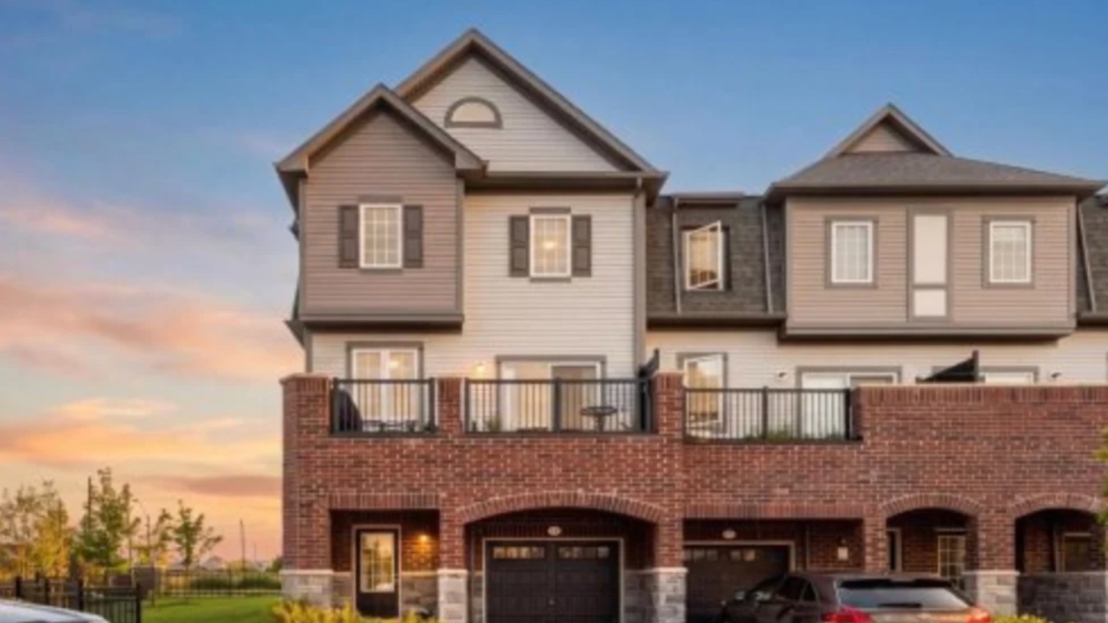 61 Honey Crisp Lane, Bowmanville, a townhouse with a rear brick terrace, sold by The Gordon Brothers Team
